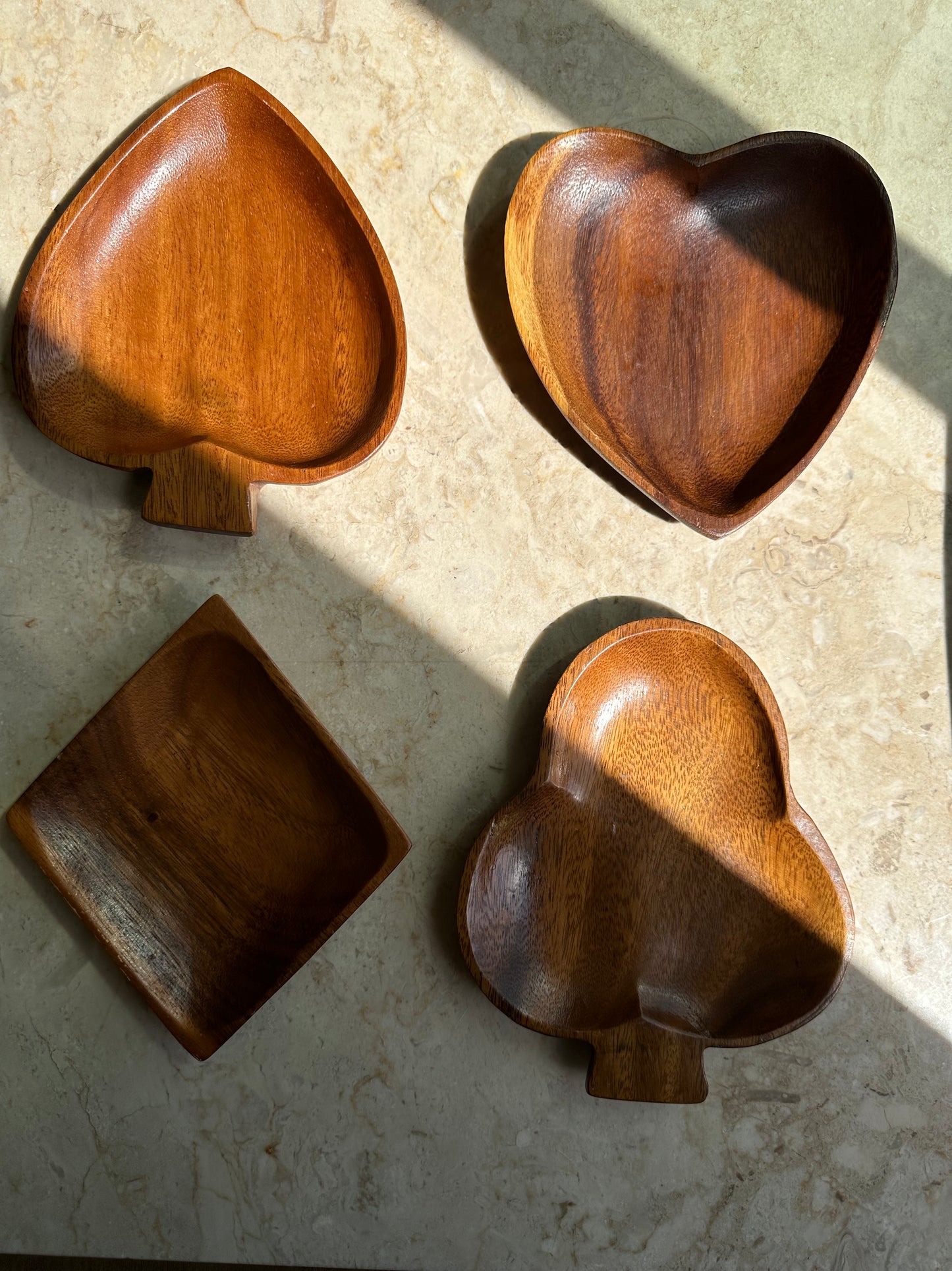 Teak trays in card suit shapes
