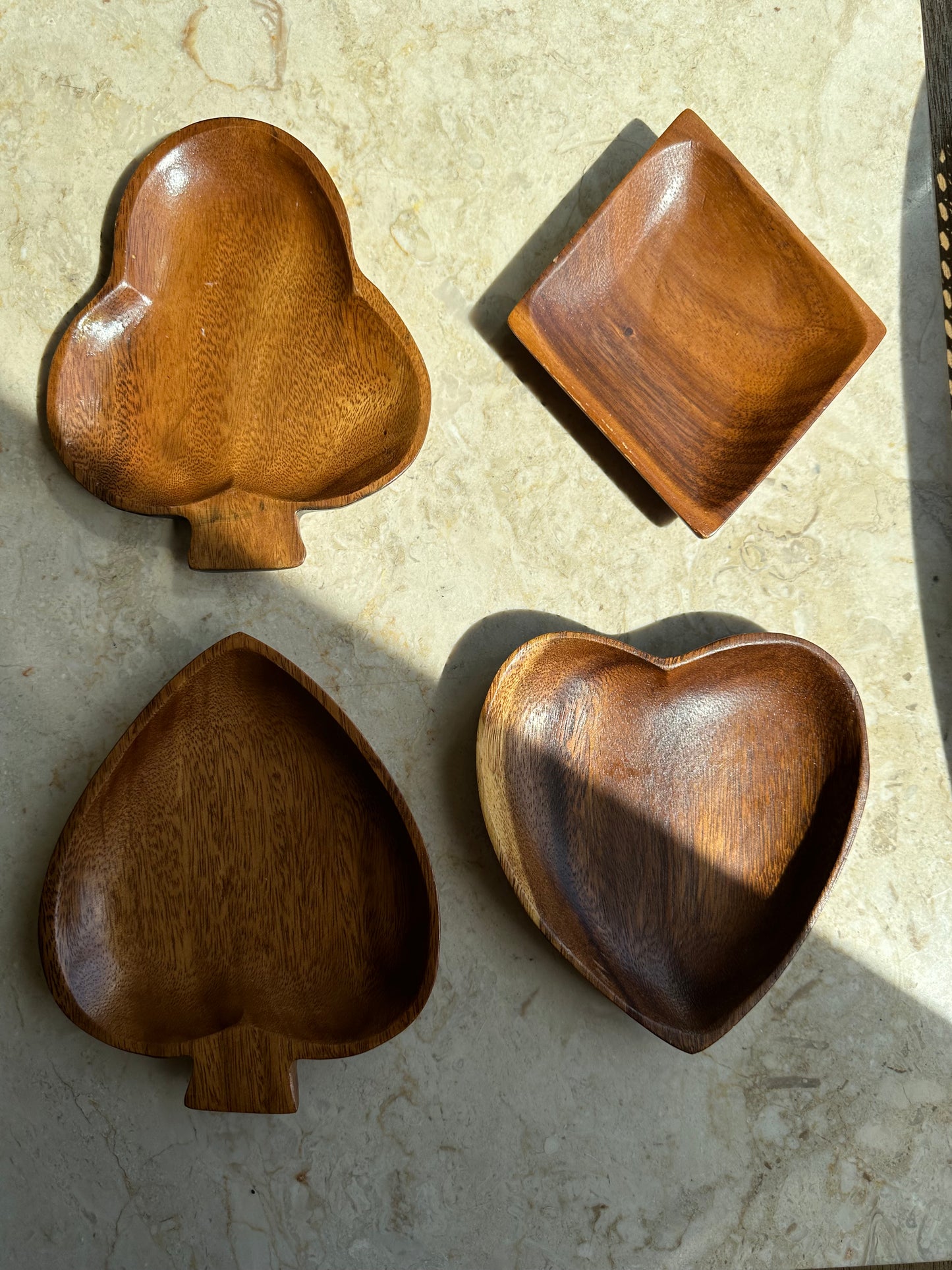Teak trays in card suit shapes