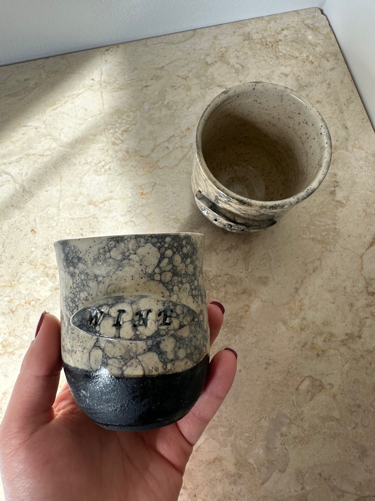 Two ceramic wine cups