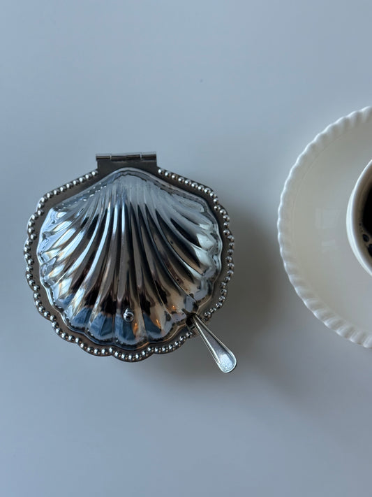 vintage  shell-shaped dish with a spoon