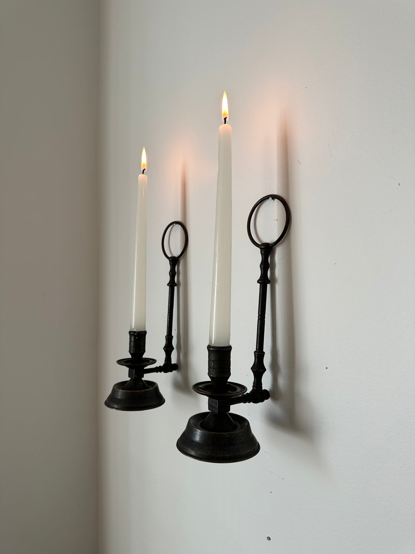 Two sconces hanging candleholders