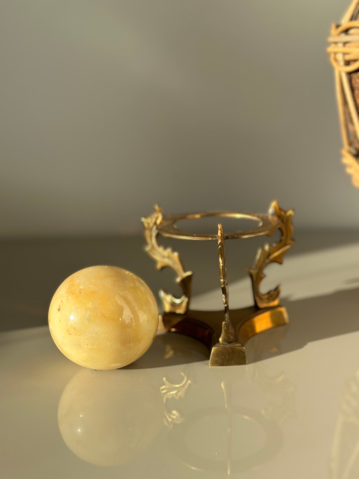 Marble sphere and brass stand