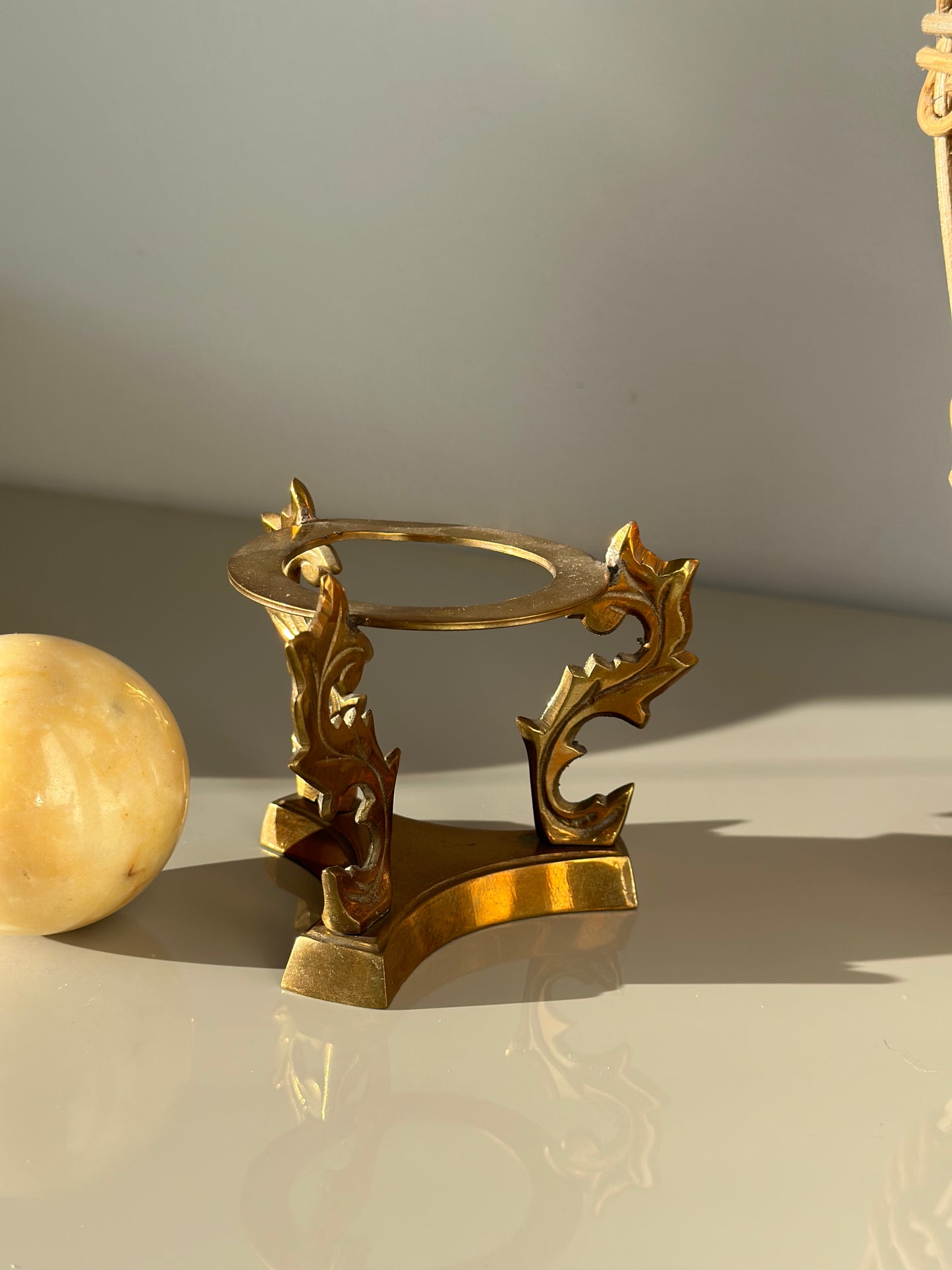 Marble sphere and brass stand