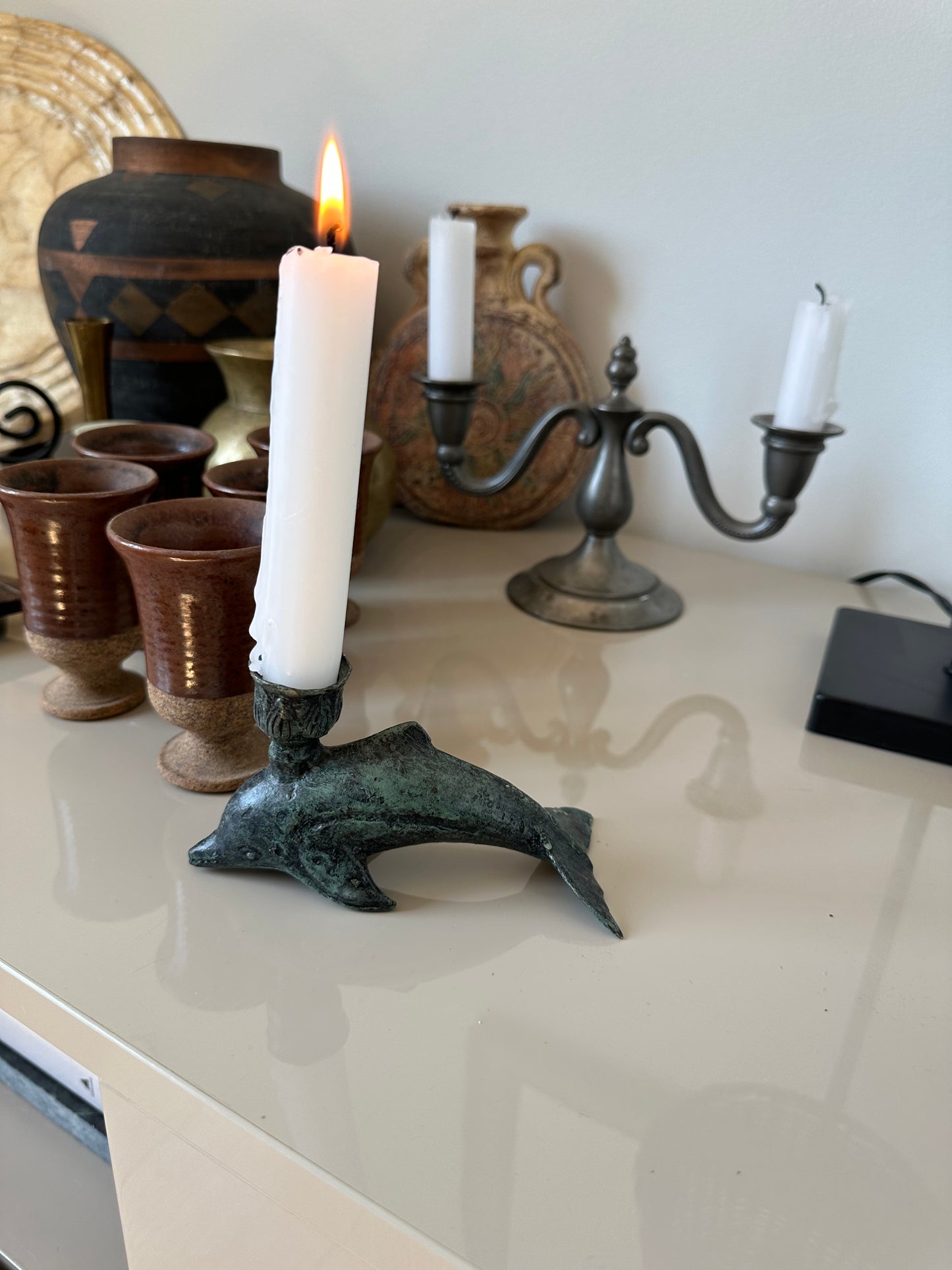 Iron dolphin candleholder