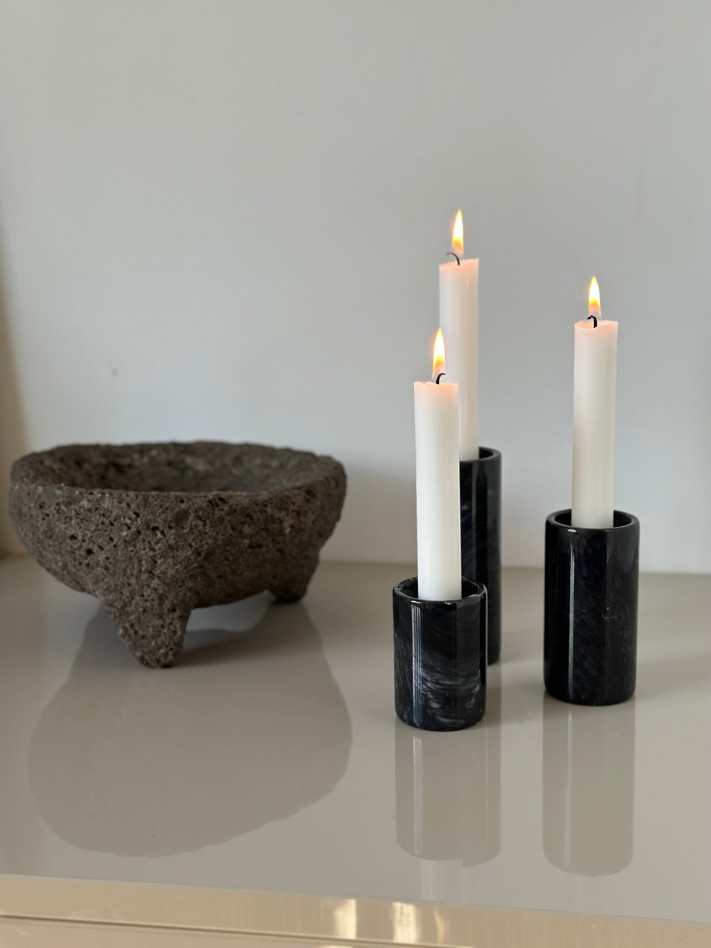 Three marble candleholders