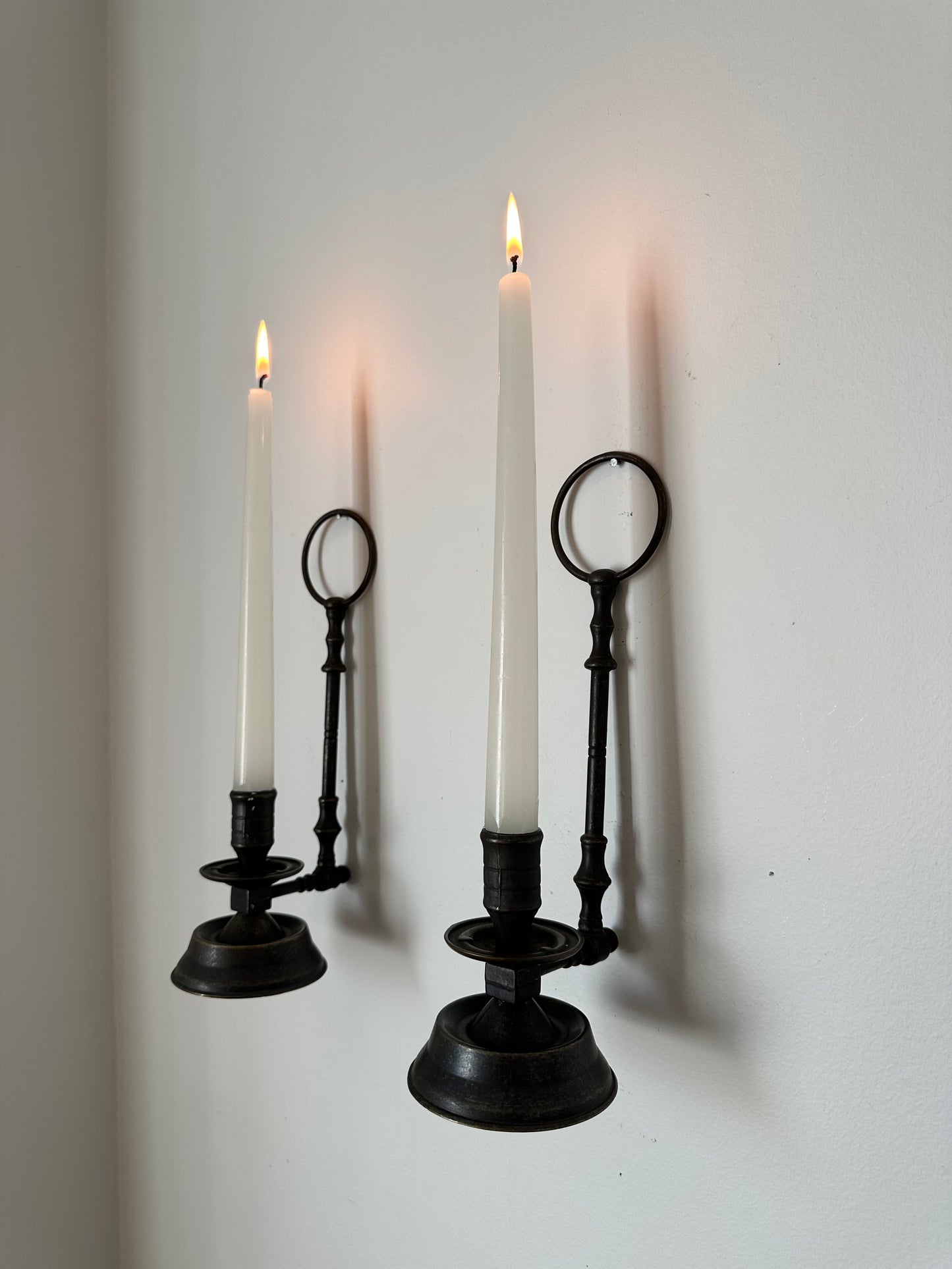 Two sconces hanging candleholders