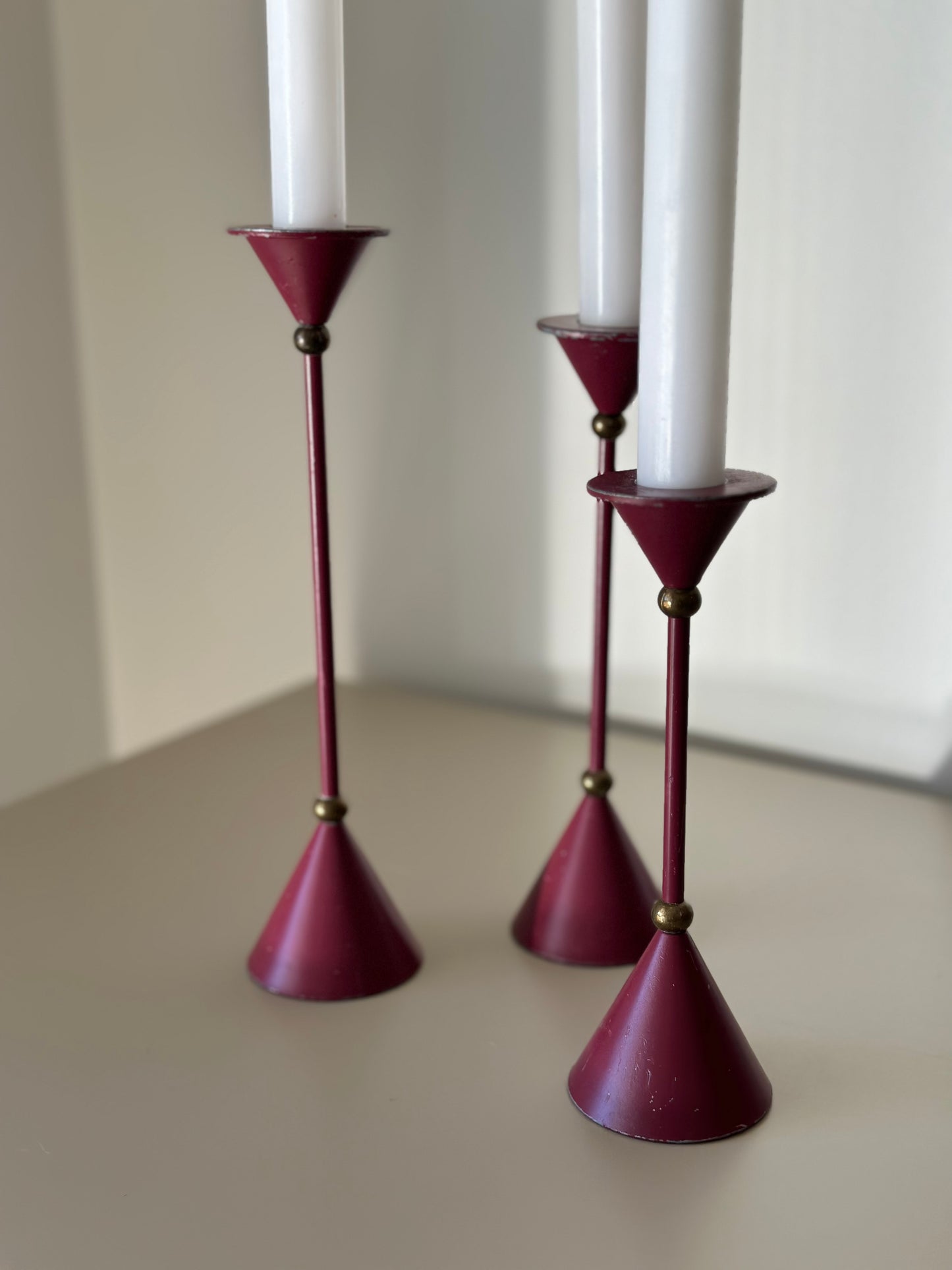 Three purple candleholders