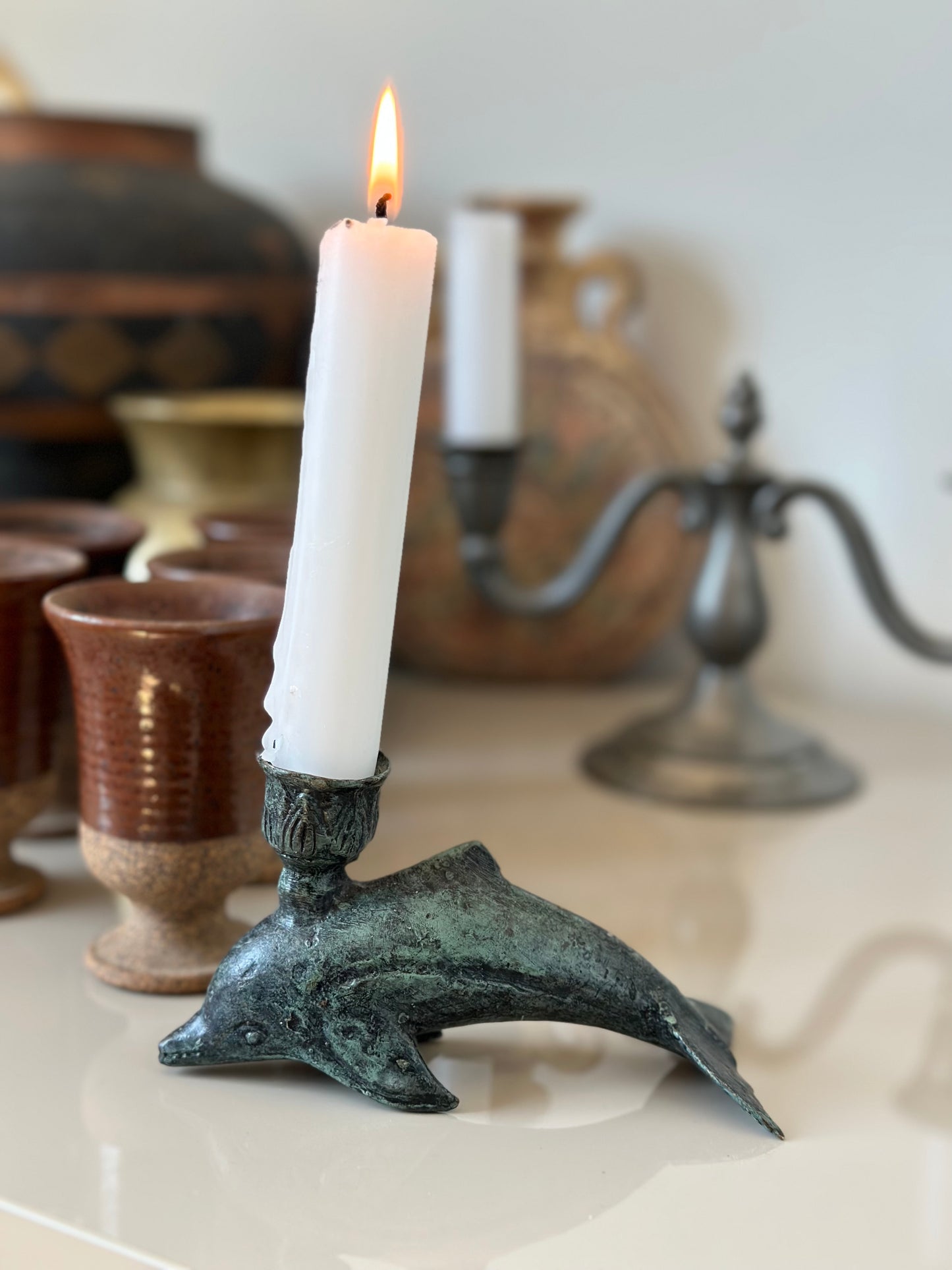 Iron dolphin candleholder