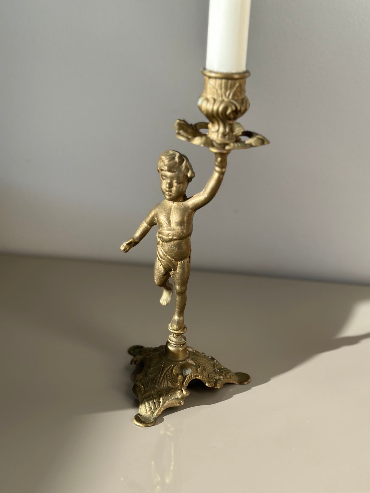 Brass cherub candleholder