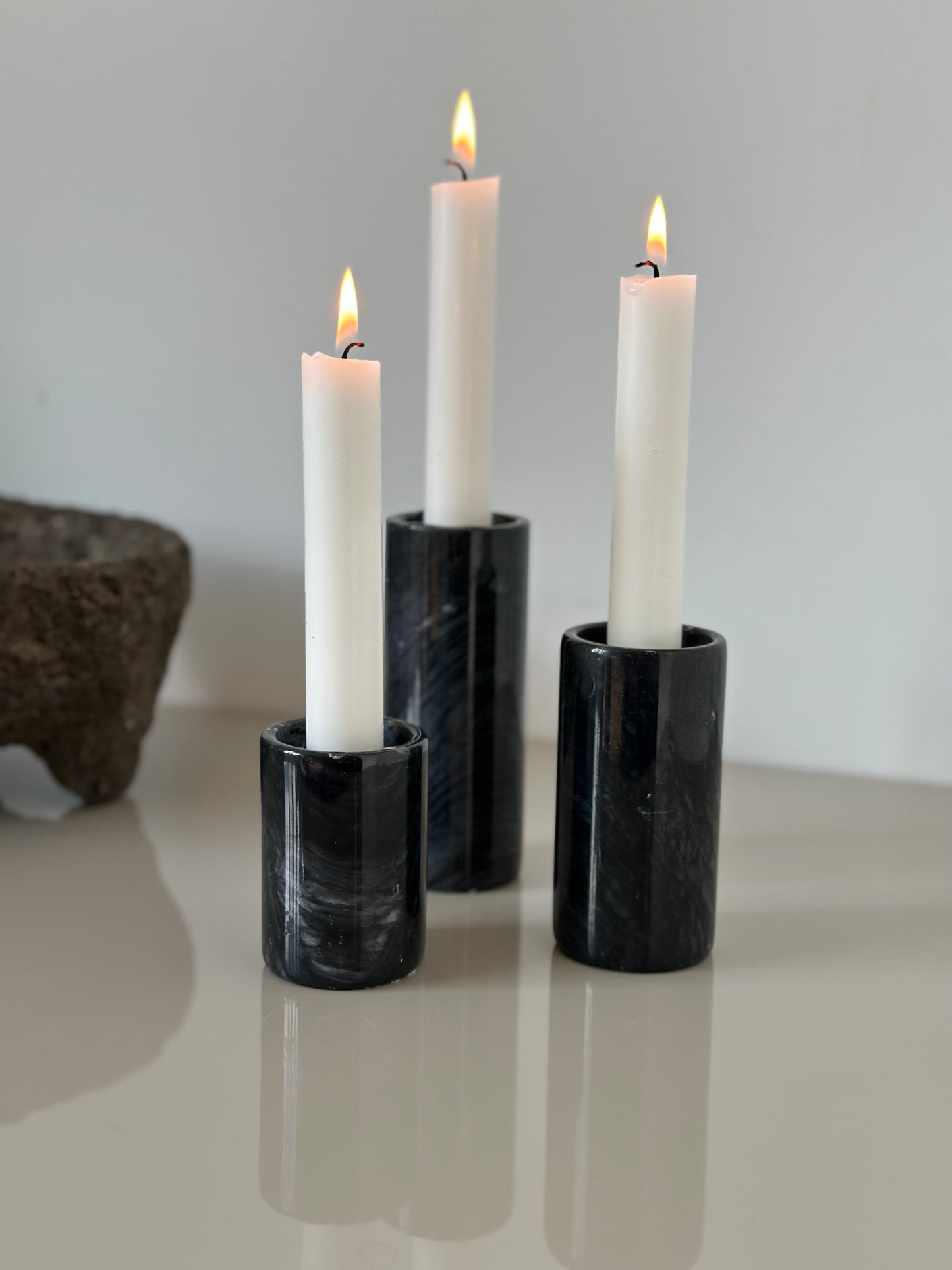 Three marble candleholders