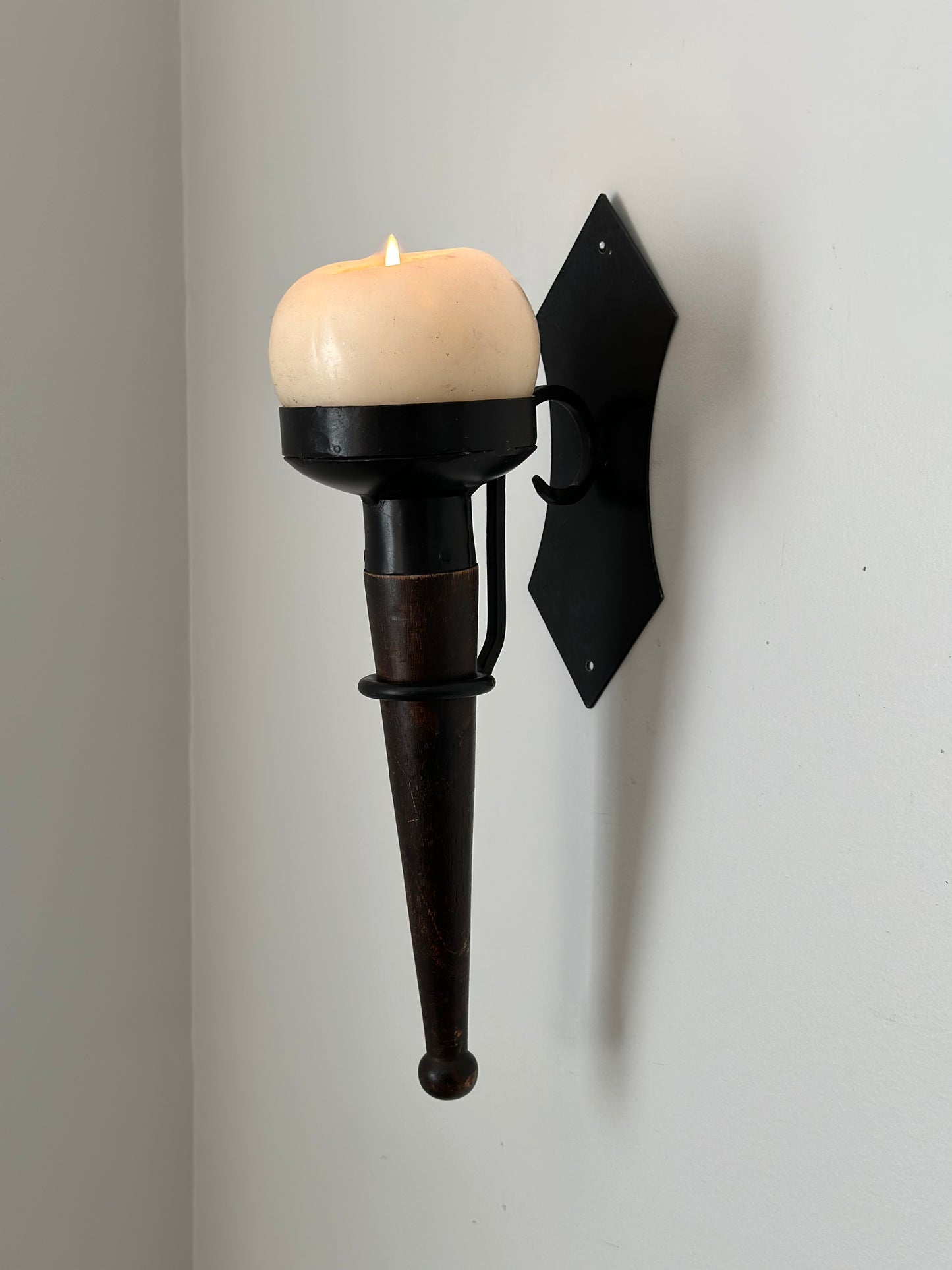 Two iron hanging candleholders