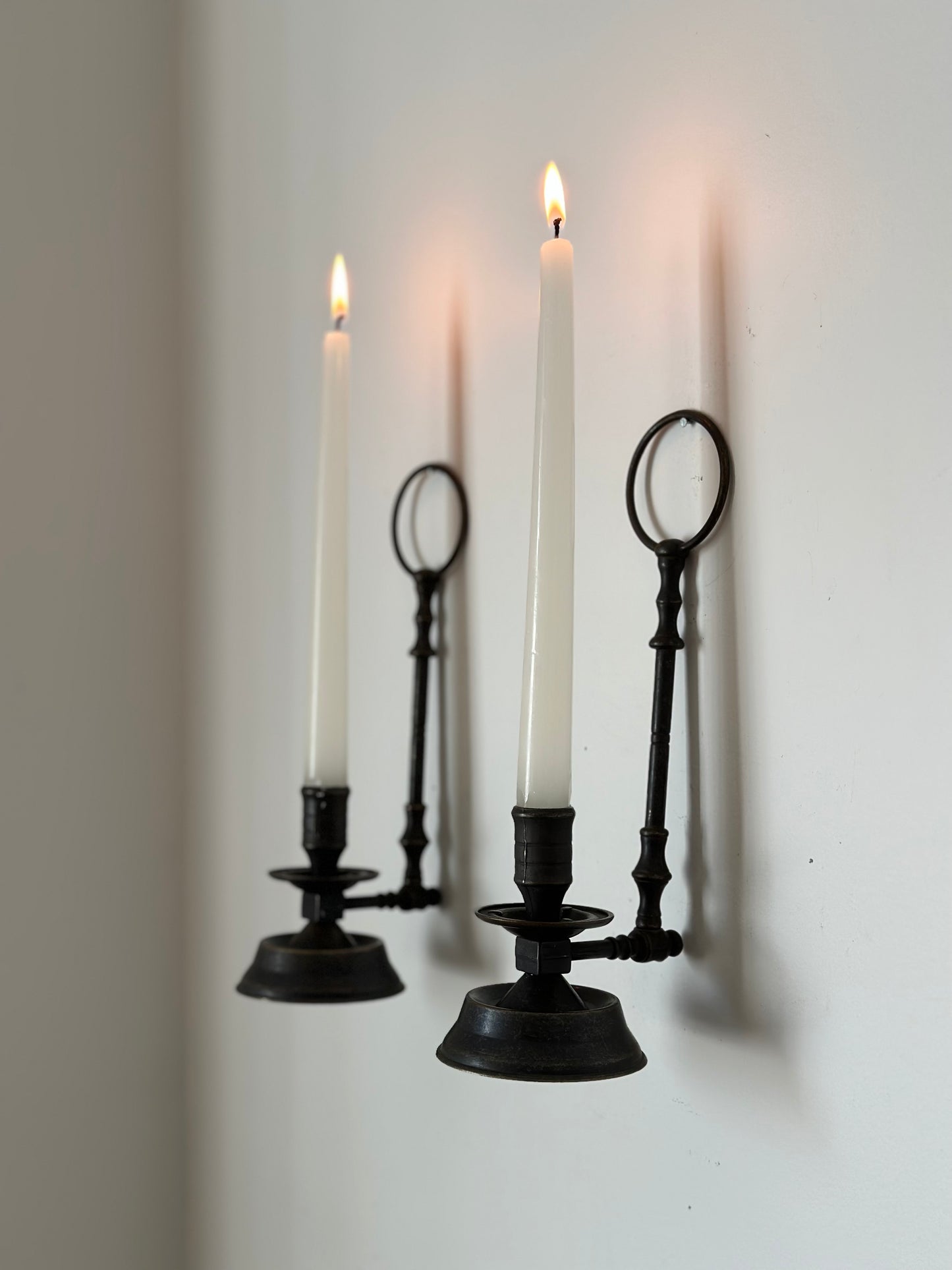 Two sconces hanging candleholders