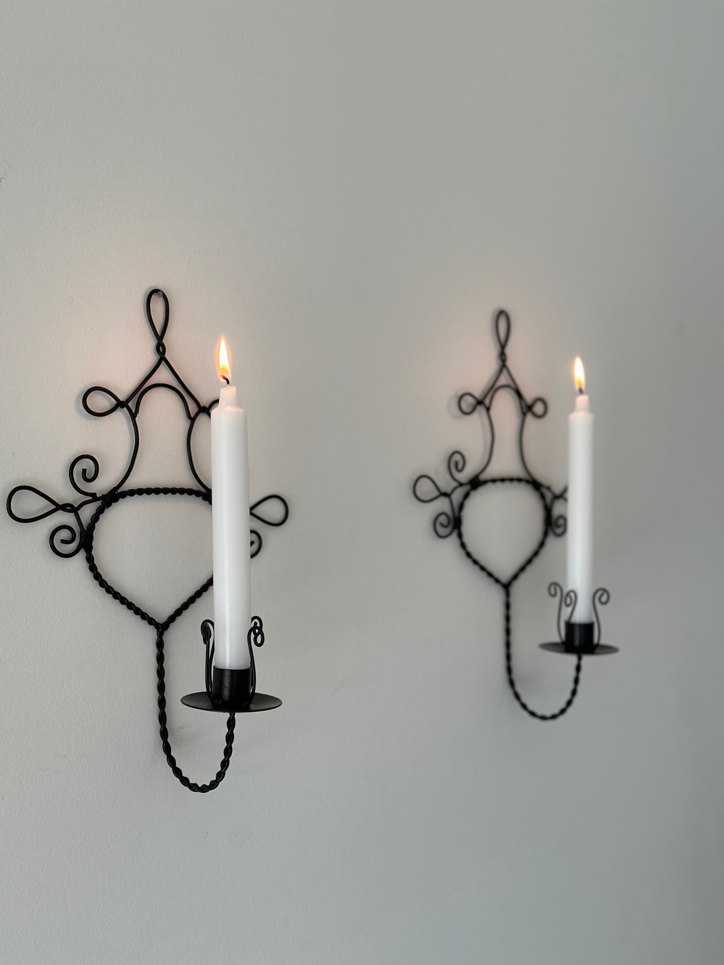 Two metal sconces