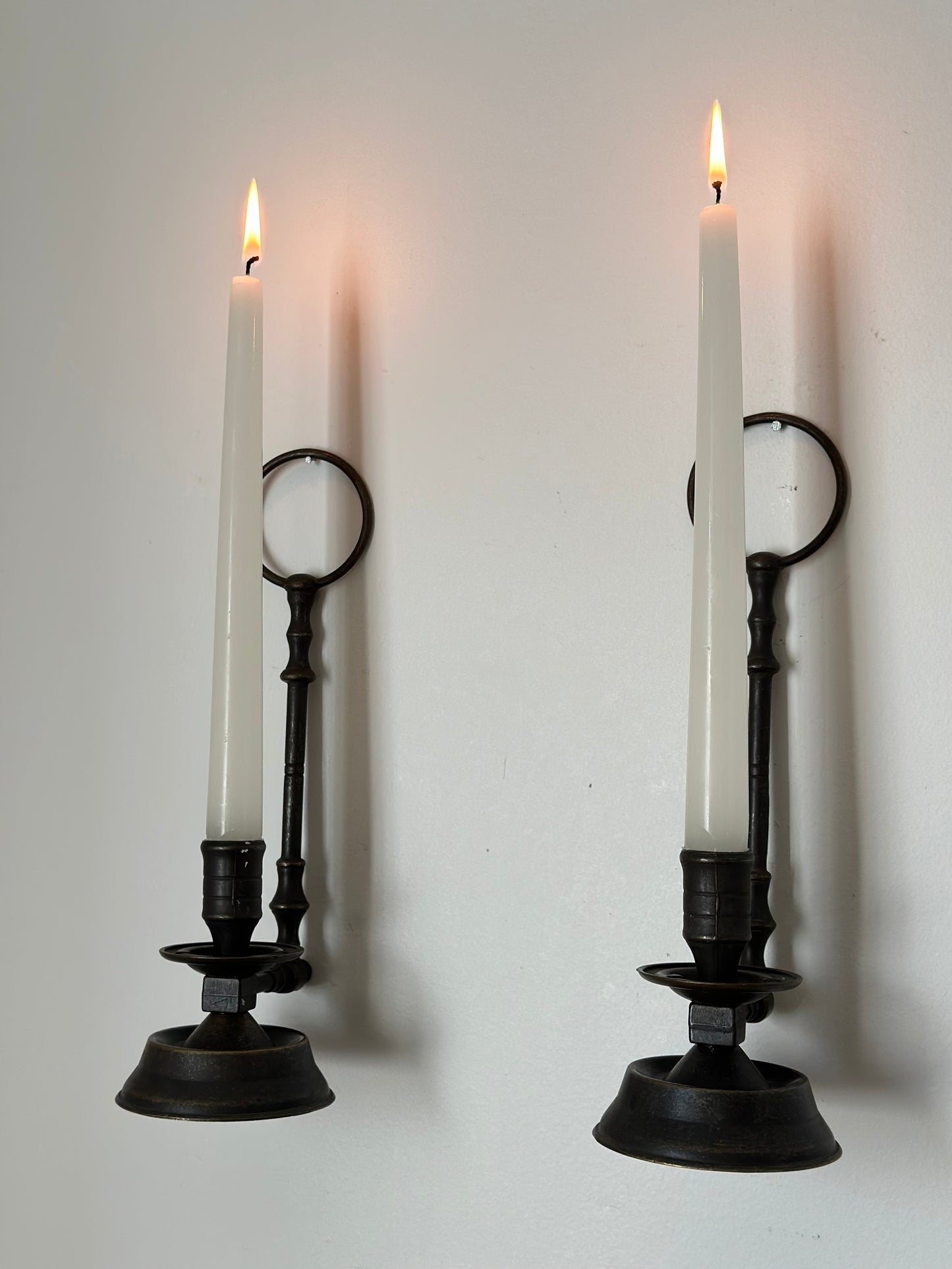 Two sconces hanging candleholders