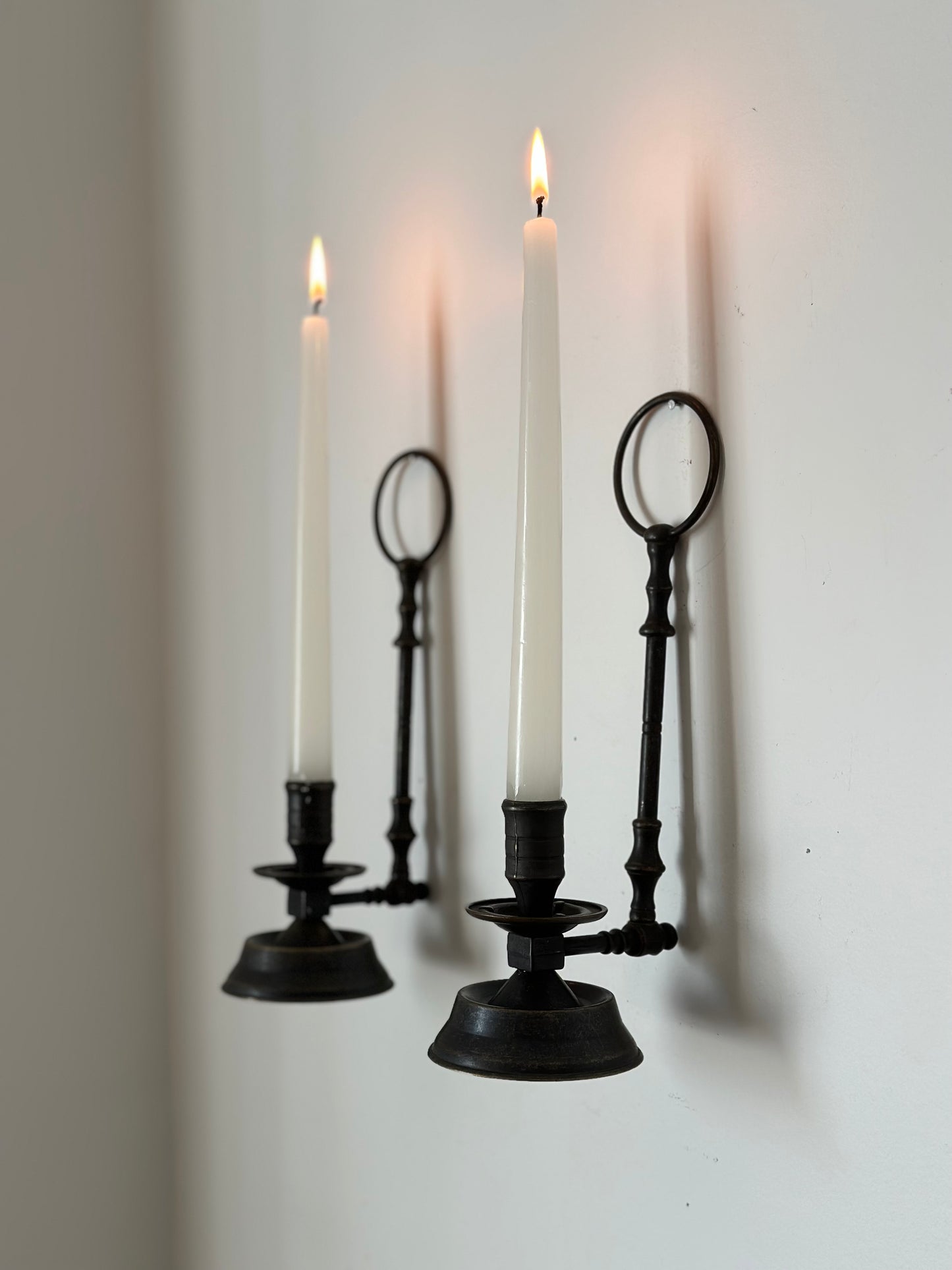 Two sconces hanging candleholders