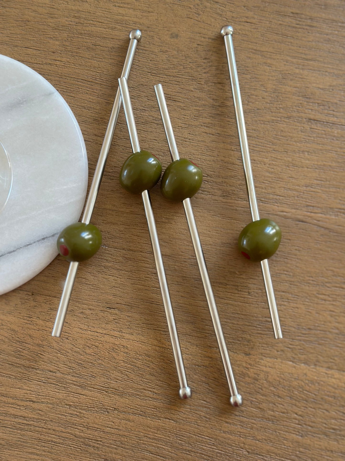 Metal straws with olive