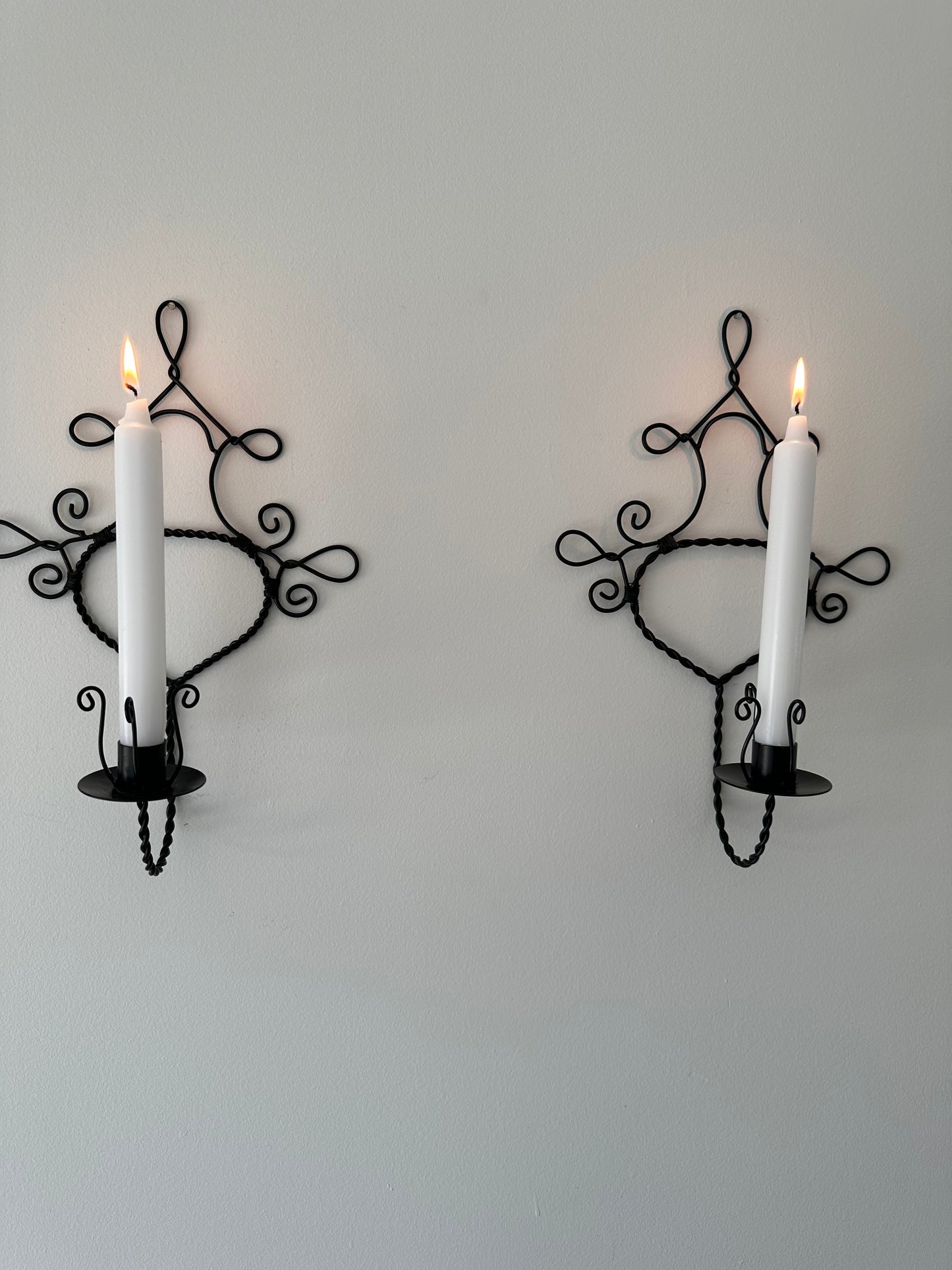 Two metal sconces