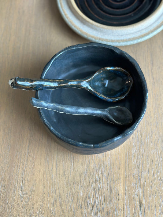 Ceramic bowl with two spoons