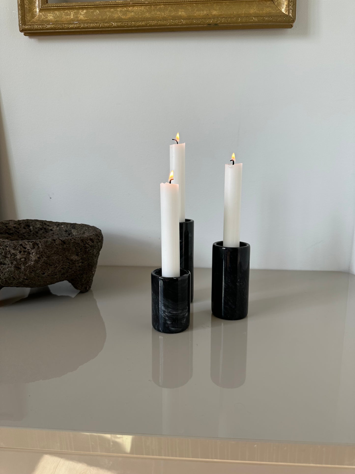 Three marble candleholders