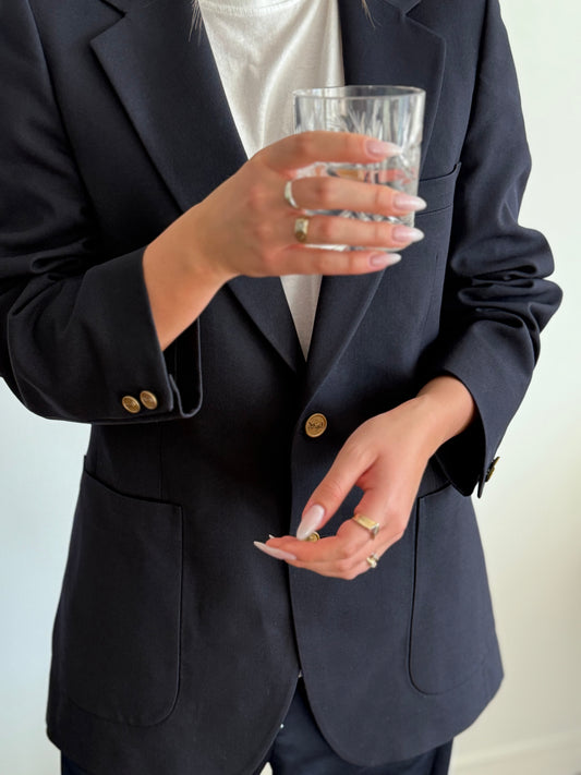Vintage ysl blazer styled with jewlery and navy blue pants 