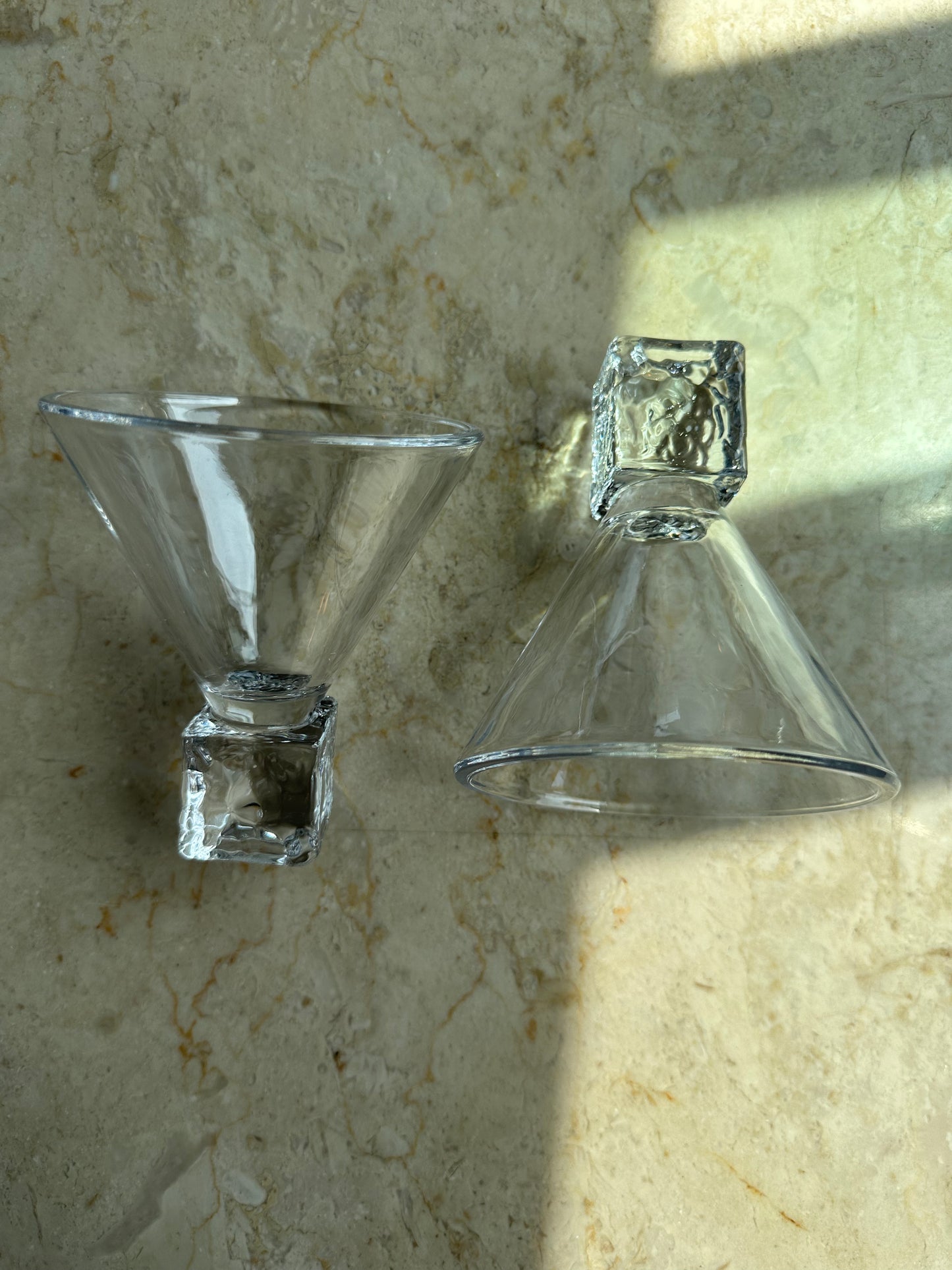 Two ice cube martini glasses