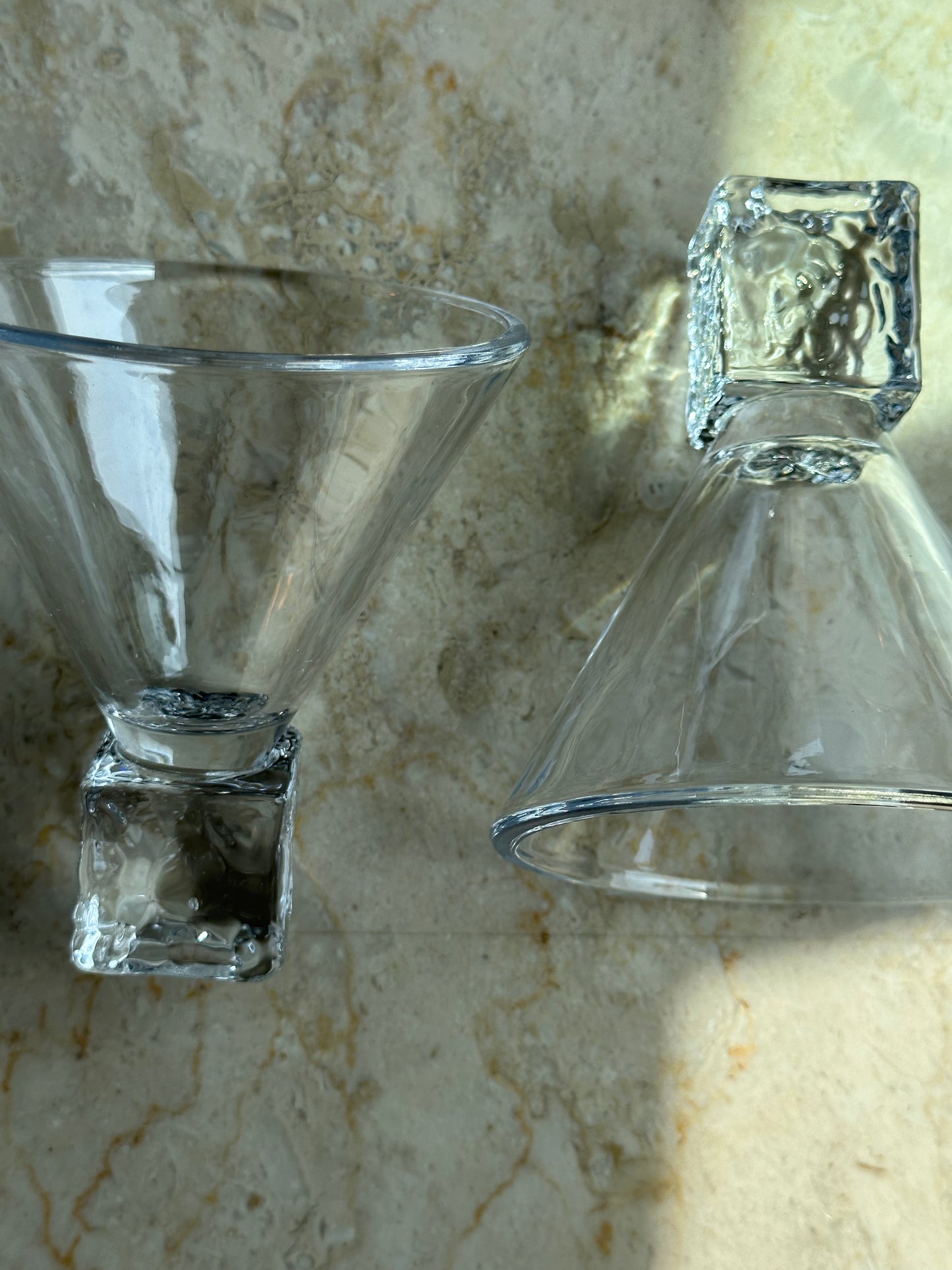 Two ice cube martini glasses