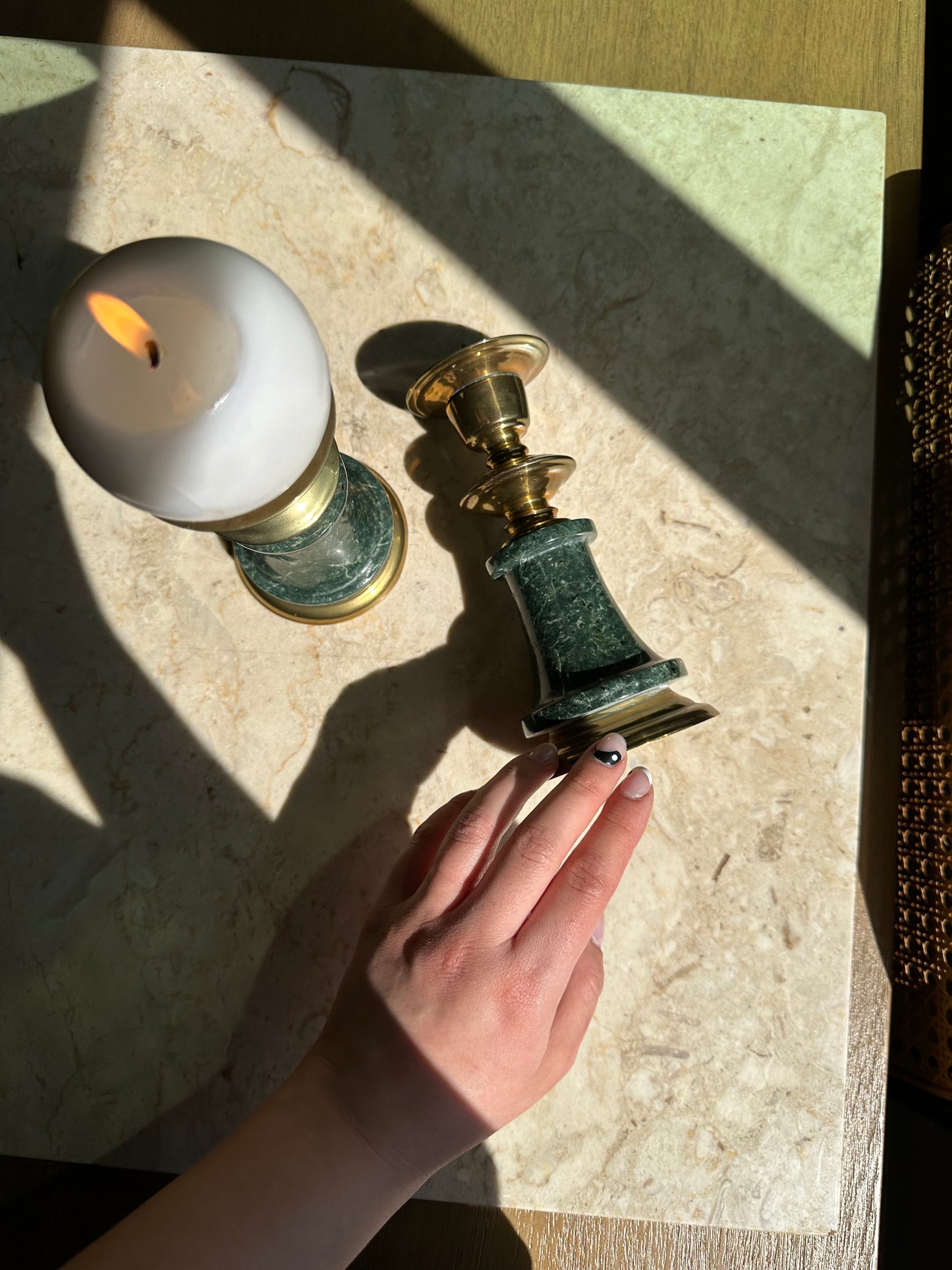 Two brass and marble candleholders