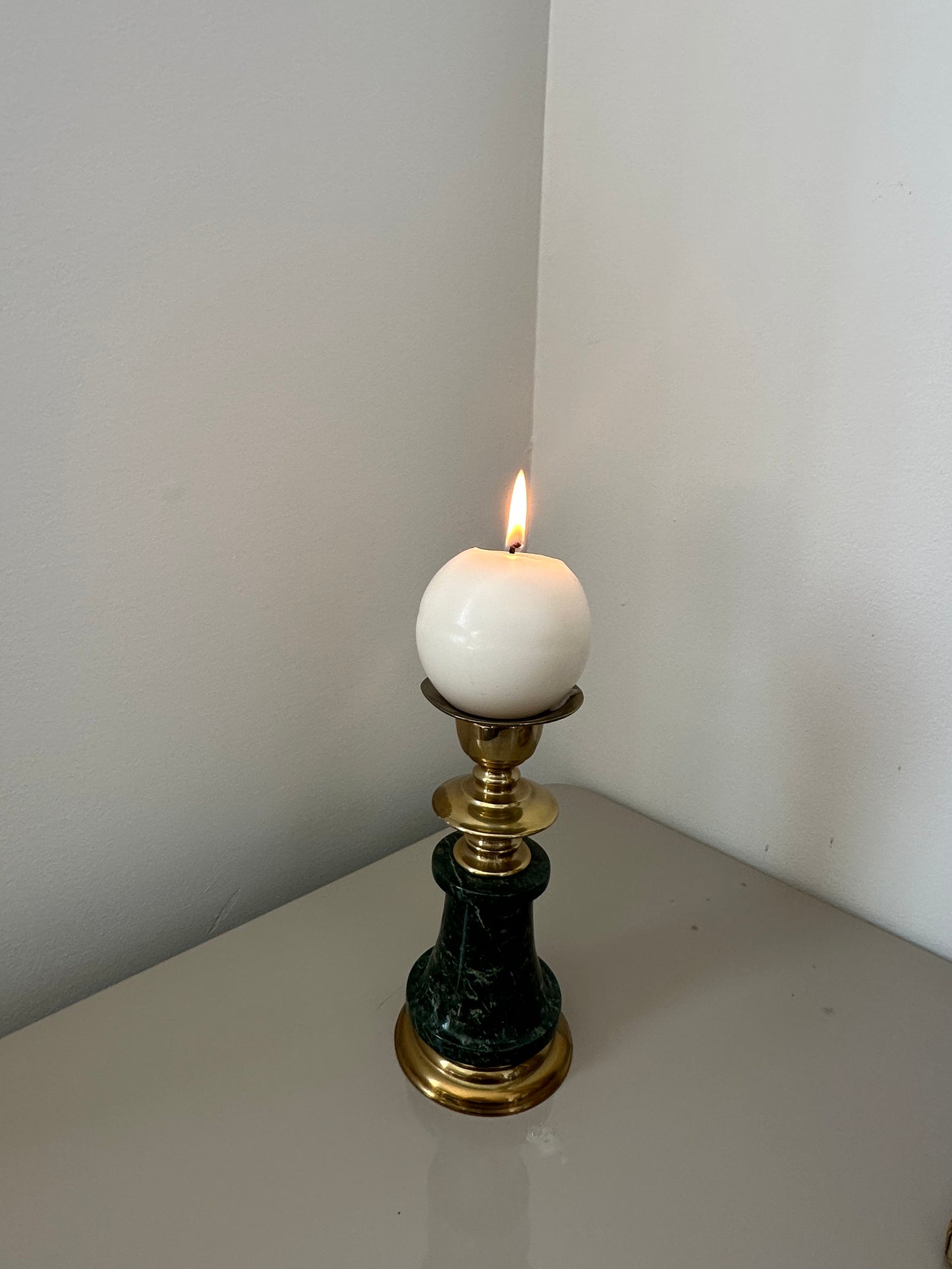 Two brass and marble candleholders