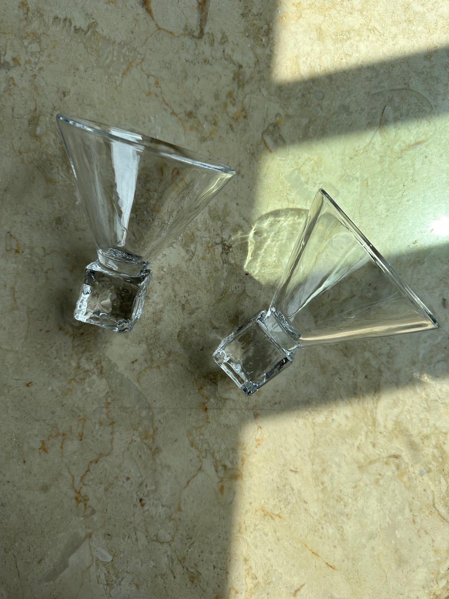 Two ice cube martini glasses