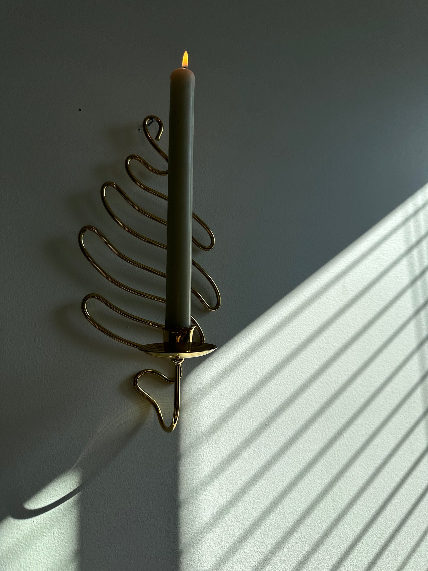 Brass swirl sconces