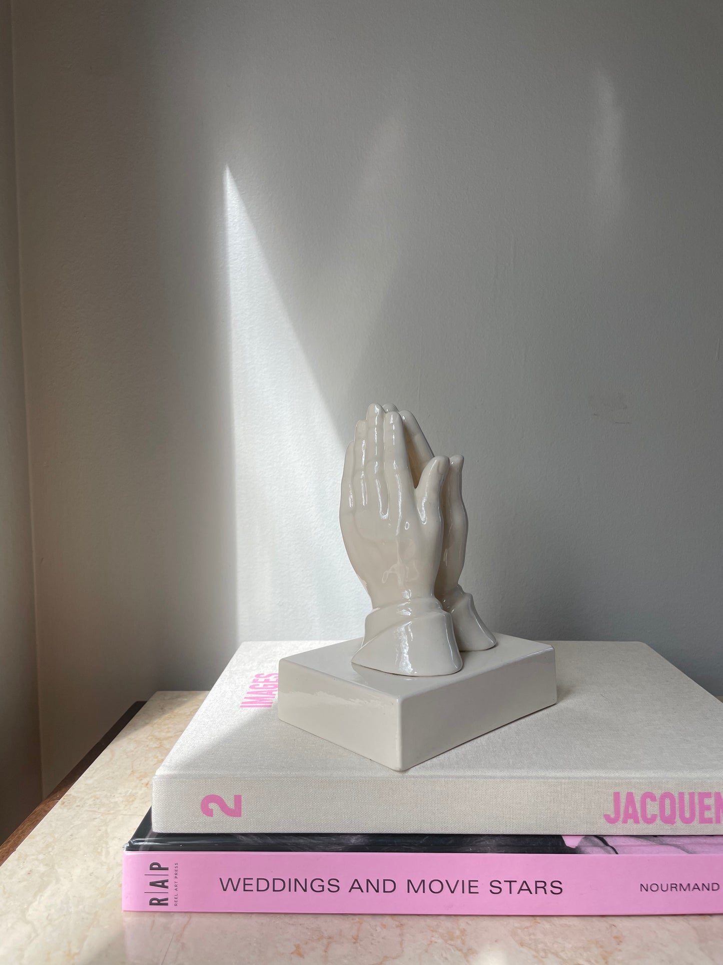 Praying hands sculpture