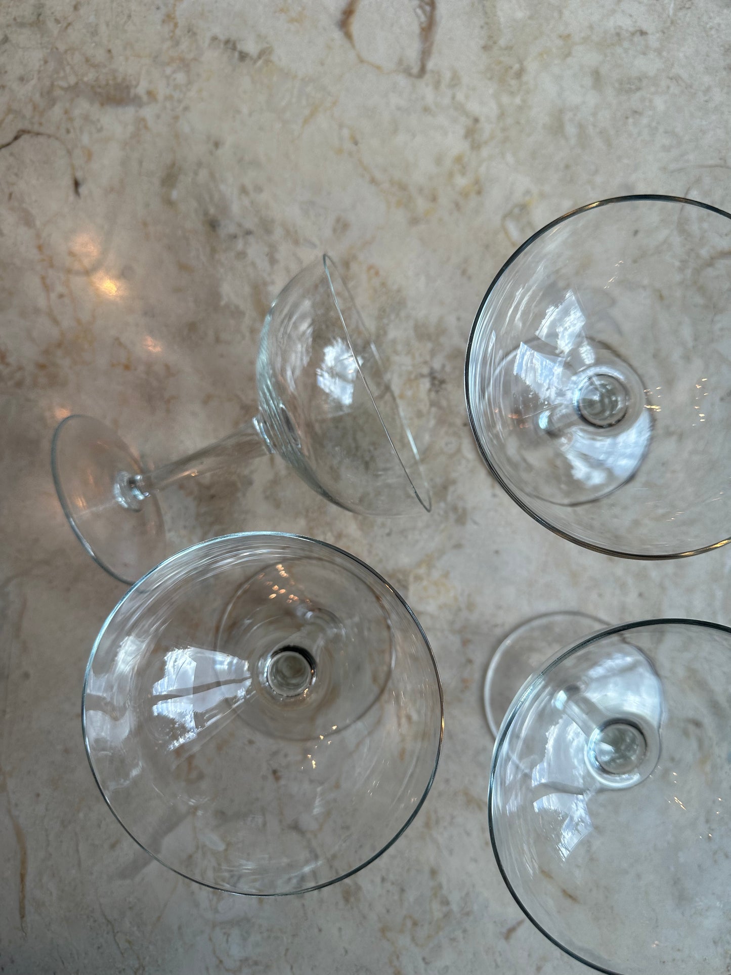 Four coupe glasses