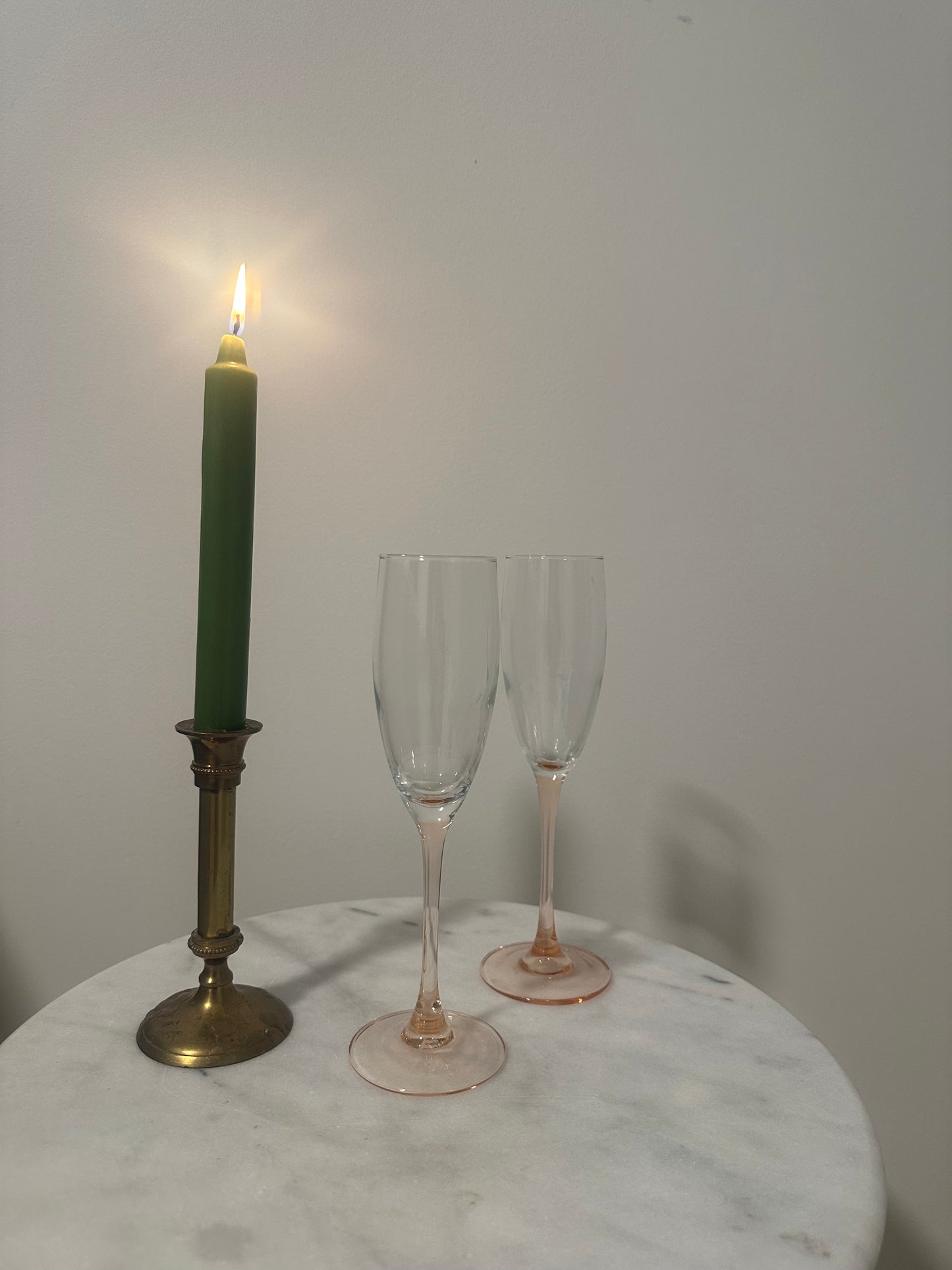 Two pink stem champagne glasses